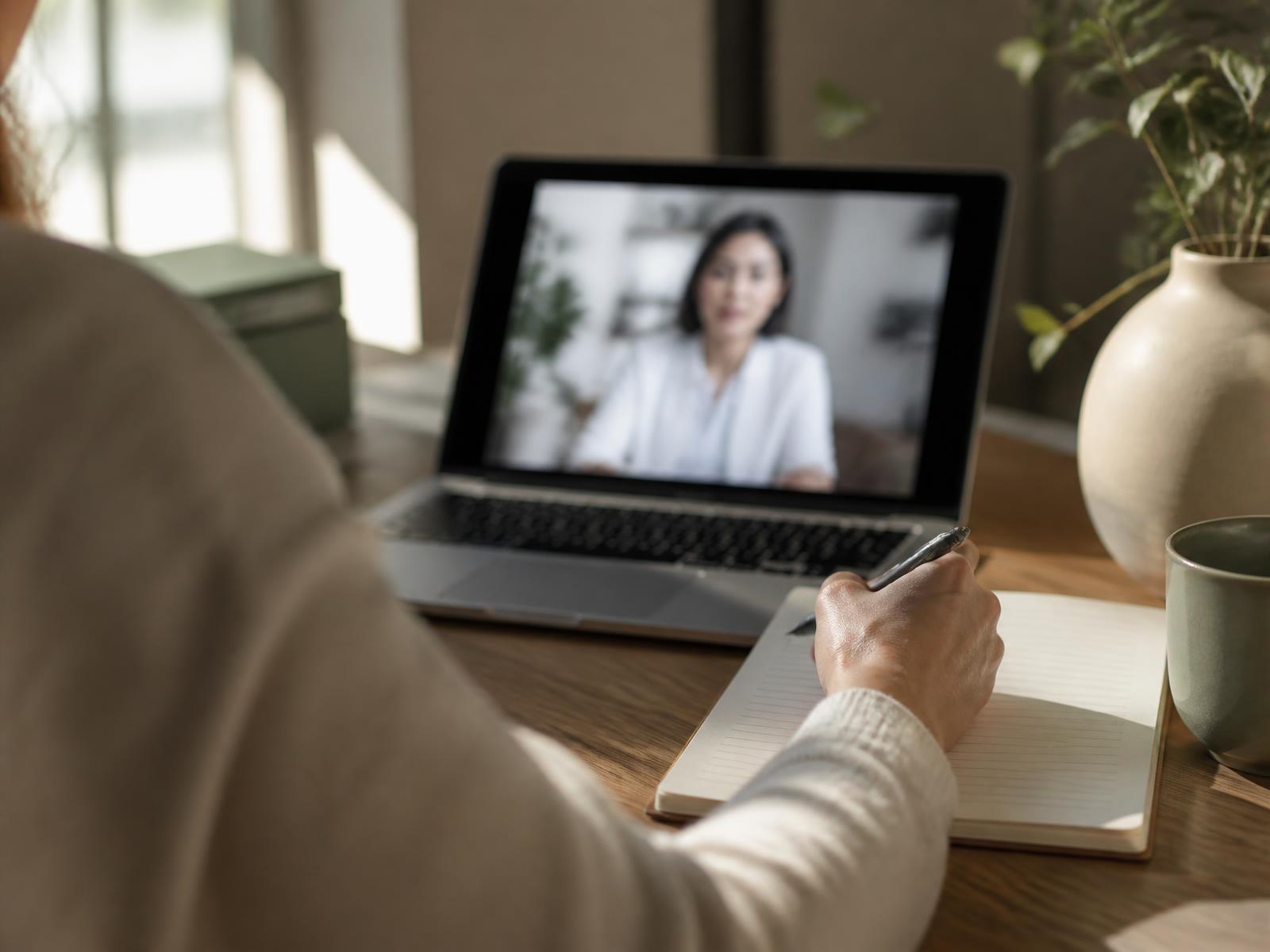 Person reviewing health information during an online consultation